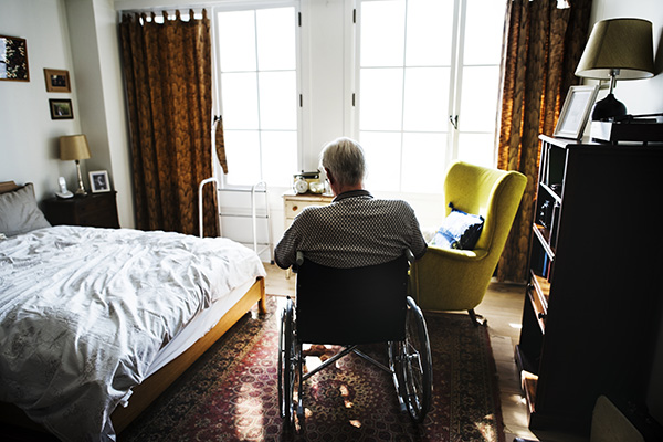 senior-man-sitting-on-the-wheelchair-alone