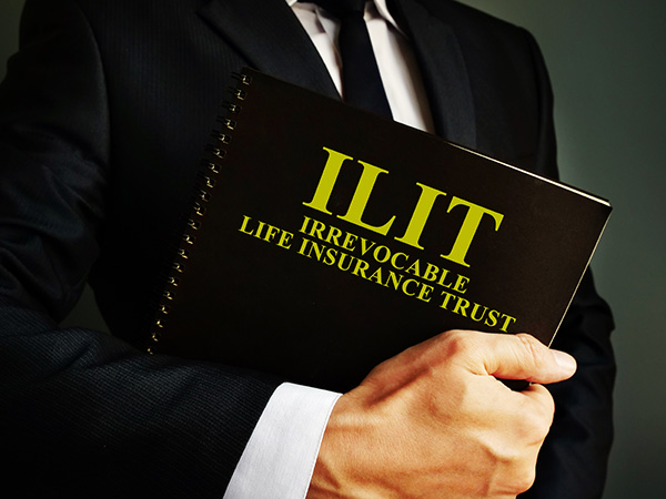 man-holds-irrevocable-life-insurance-trust-ilit-policy